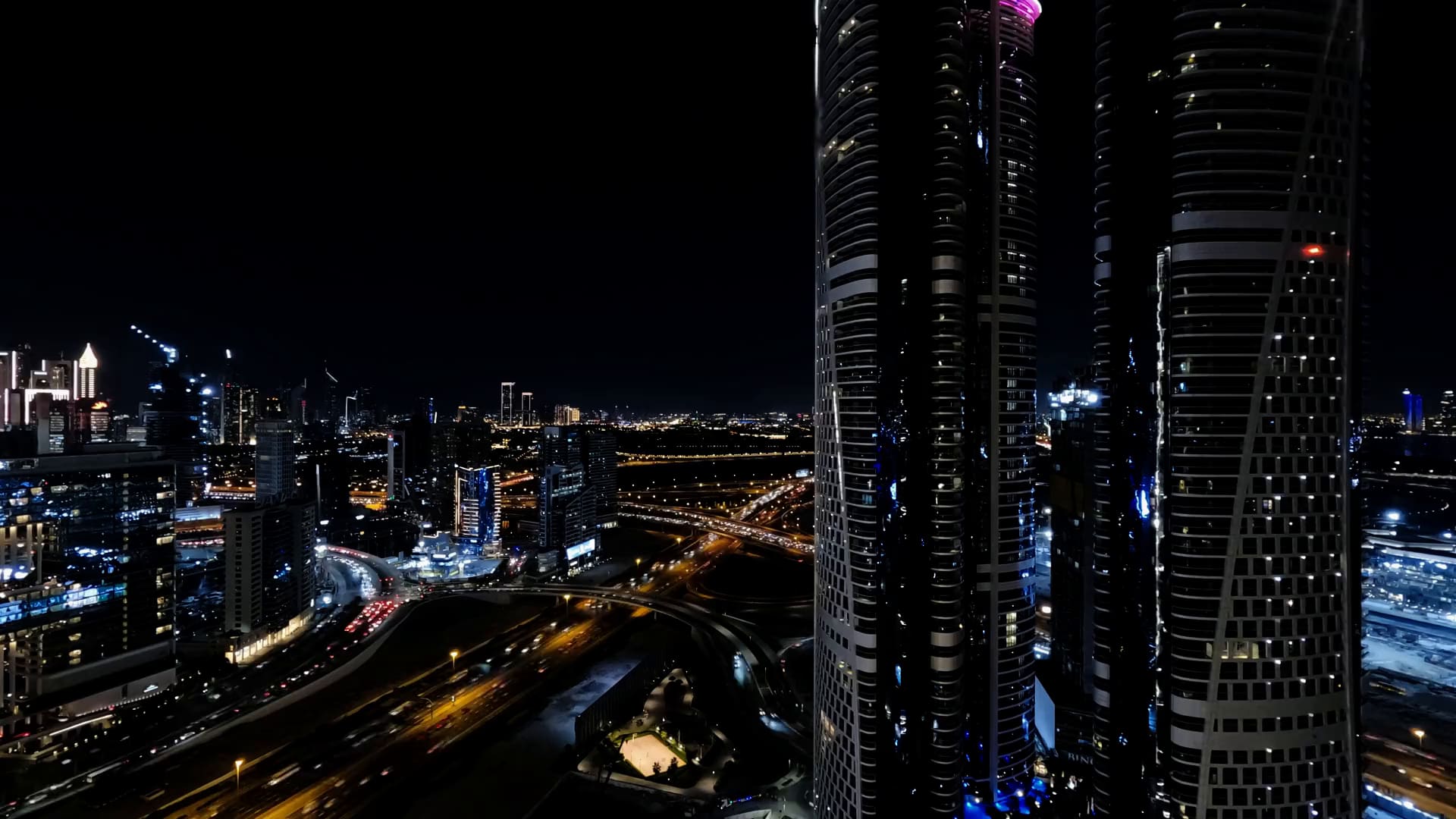 Dubai Marina towers and the city at night, from above